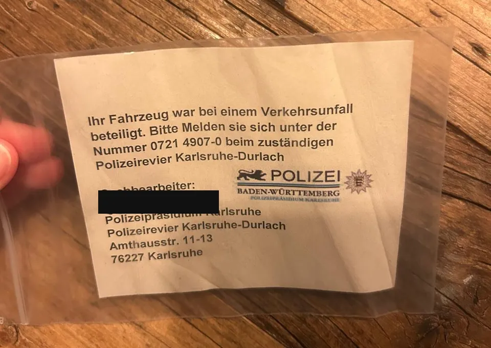 Note from the Karlsruhe-Durlach police station in a plastic sleeve, caseworker's name blacked out