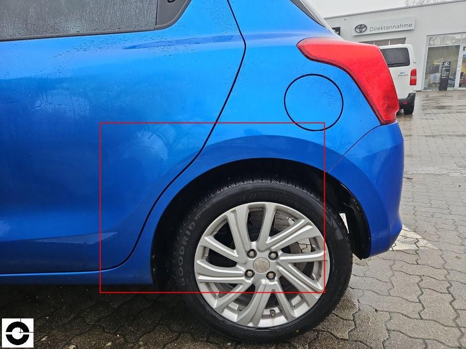 Hinterer linker Kotflügel und Radlauf, nass, keine sichtbaren Schäden im markierten Bereich